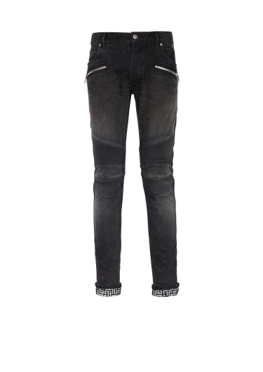 Slim cut faded and ridged cotton jeans with Balmain monogram on hem